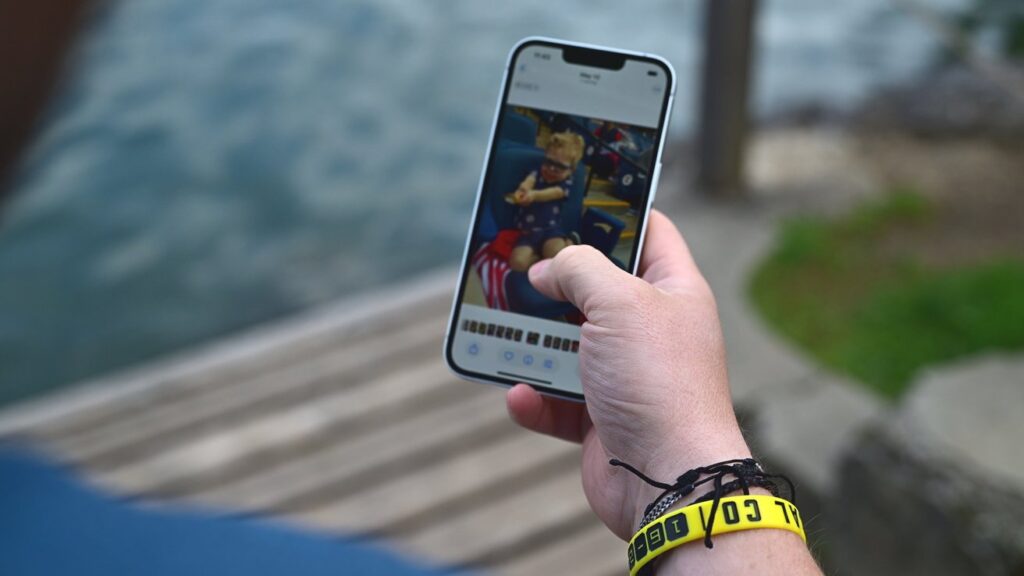 63739-132629-Holding-iPhone-16e-Outside-xl